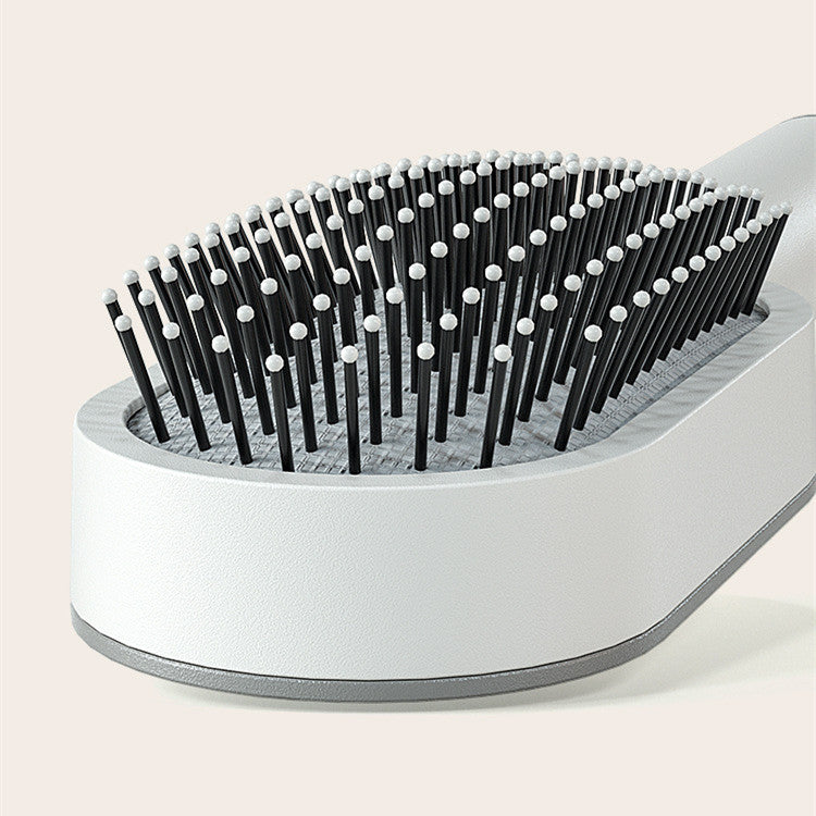 Brosse à cheveux autonettoyante